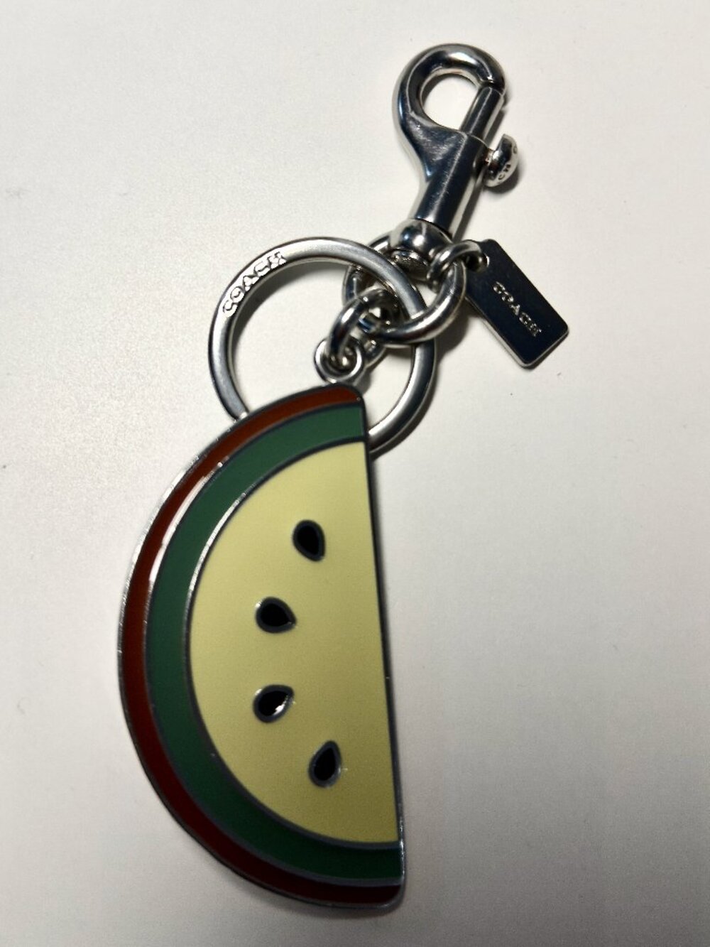 Excellent condition Coach enamel melon bag charm.  All 5-star reviews.